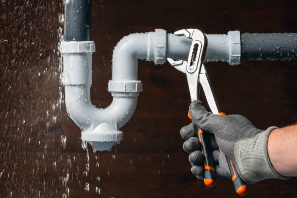 Professional Emergency Plumber technician working in Bedford, MA